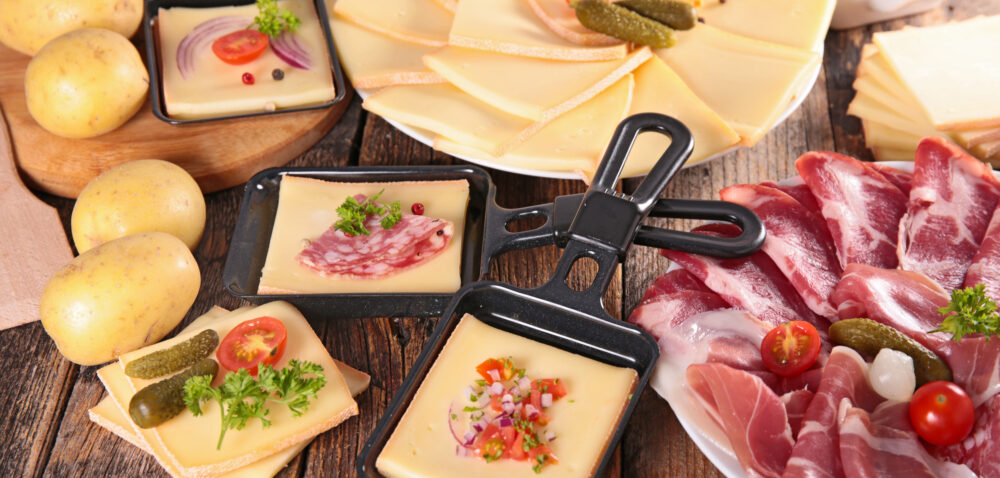 raclette party with cheese,potato and meat
