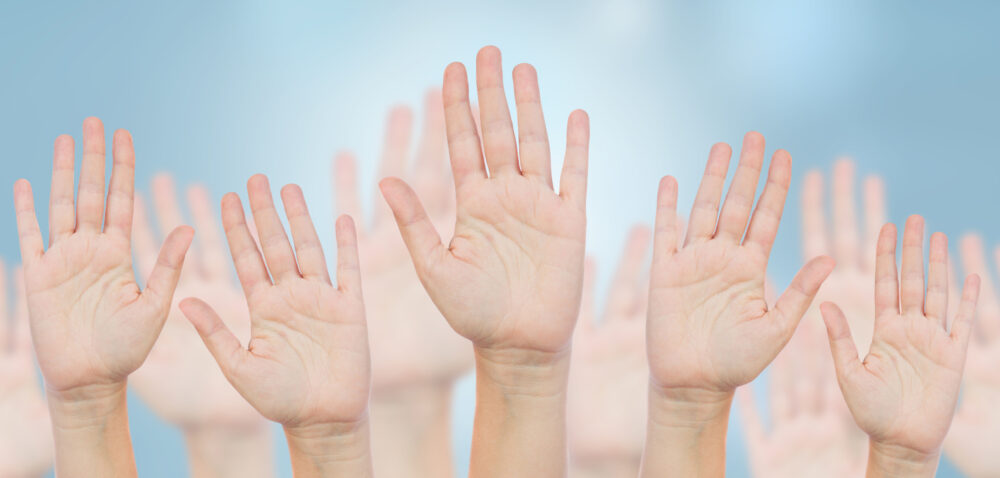 Hands up in the air - voting concept